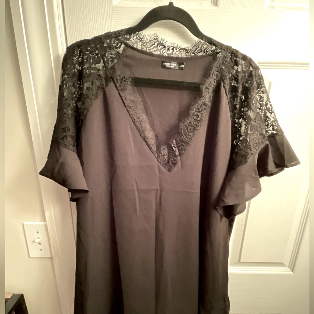 Black blouse with lace on sleeves and V-neck